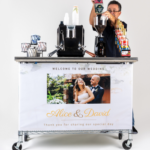 coffee cart Angel pouring coffee into coffee cart grinder; wedding banner on coffee cart