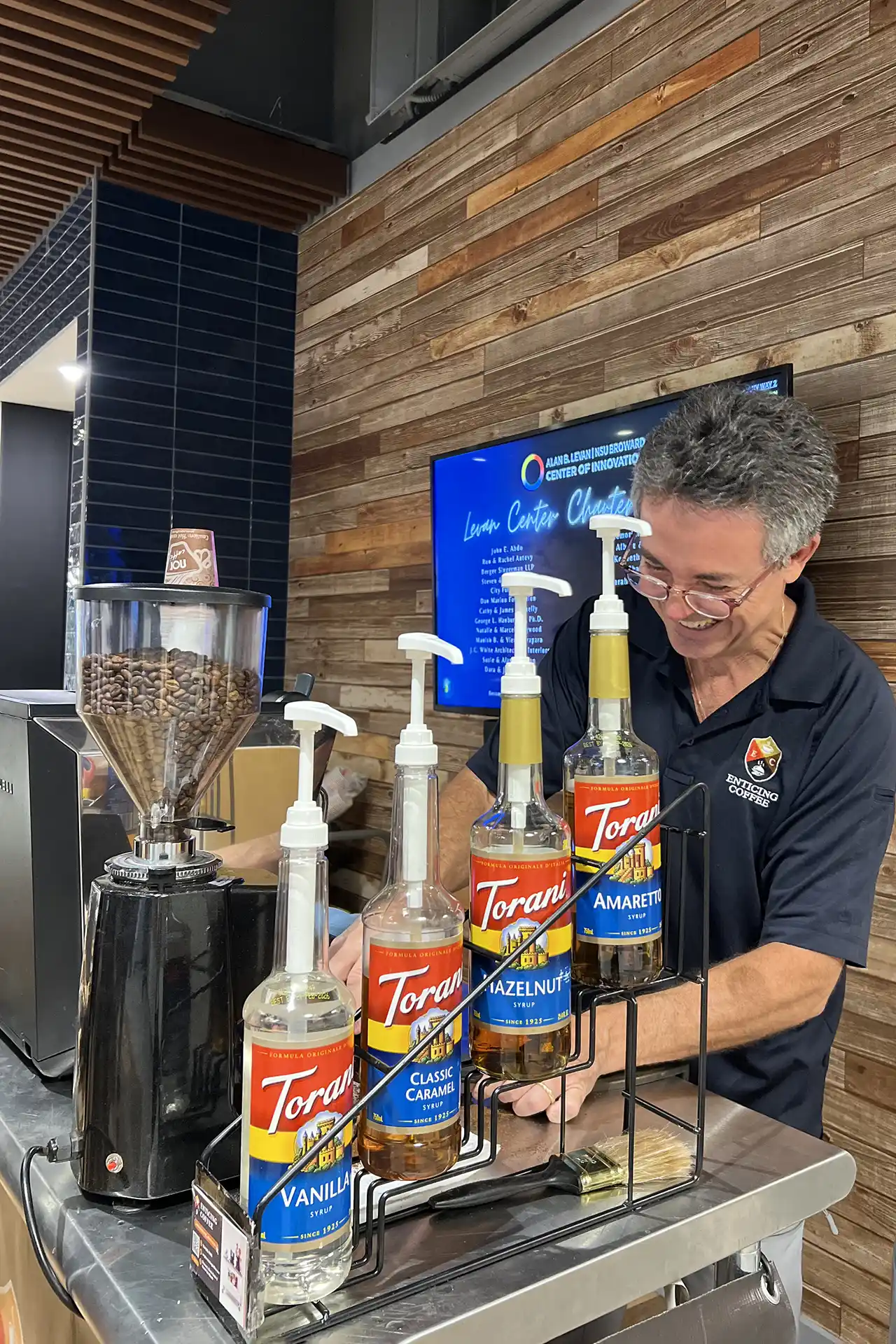 Angel serving coffee from grinder